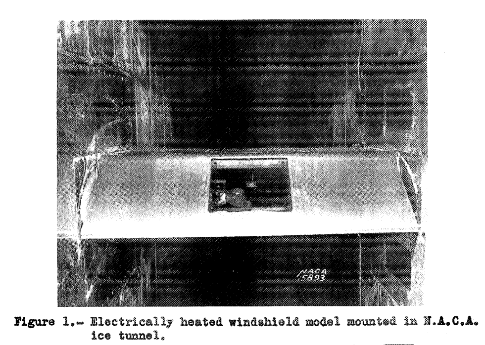 Figure 1. Electrically heated windshield model mounted in N.A.C.A. ice tunnel.
